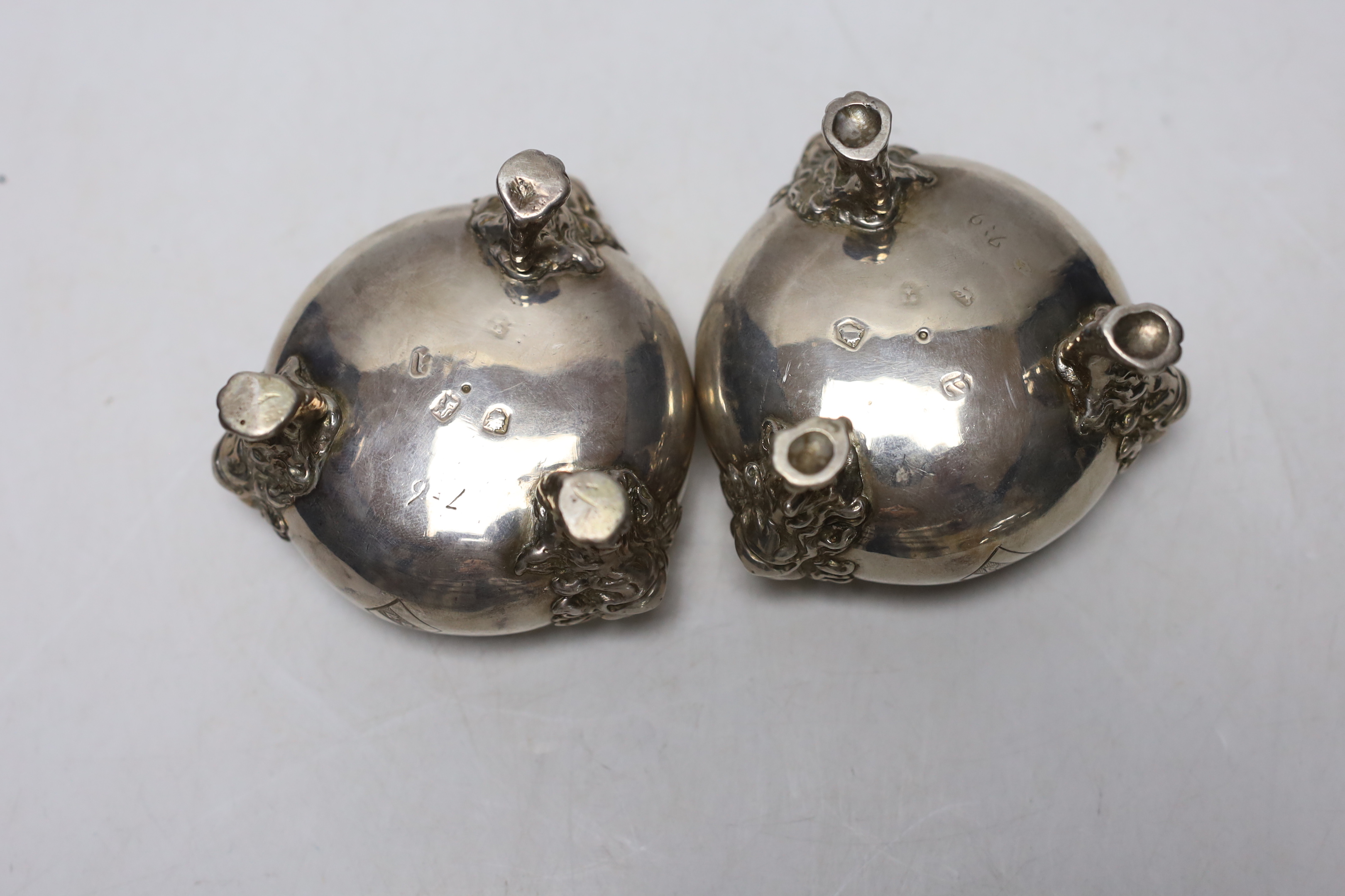 A pair of George II silver bun salts, with lion mask knees, on paw feet, maker's mark rubbed, London, 1736, diameter 70mm, 11.9oz.